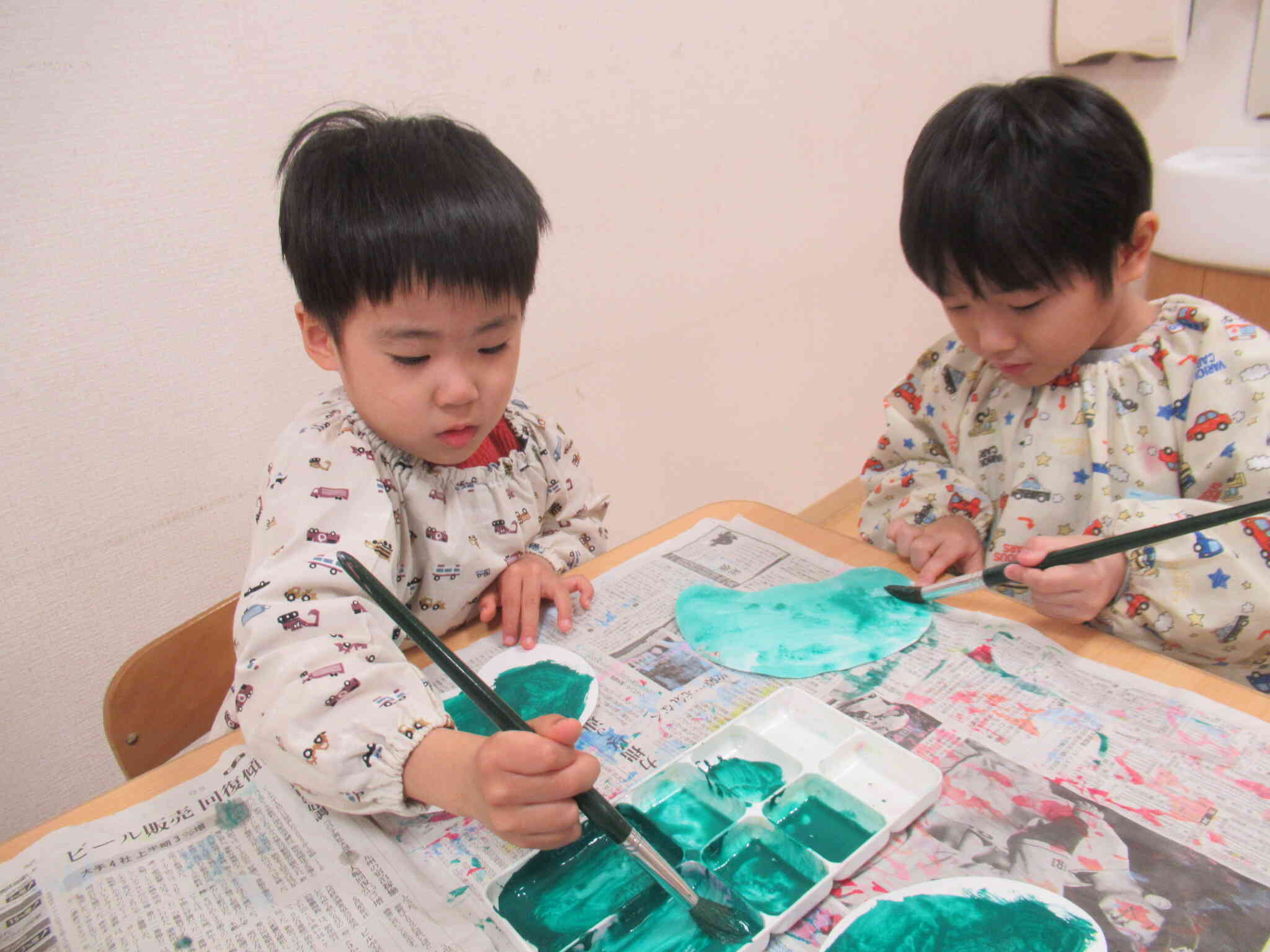 獅子舞のお洋服は緑なんだって～。
